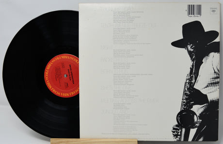 Vinyl record with a black and white cover featuring a saxophonist.