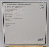 The back cover of a vinyl record sleeve for Bruce Springsteen's 'Dream Baby Dream', showing track listing, credits, and barcode on a white background.