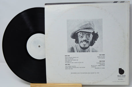 Back cover of Bruce Springsteen Live at The Bottom Line vinyl showing tracklist and artist photo