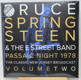 Ruce Springsteen & The E Street Band 'Passaic Night 1978' vinyl record cover, Volume Two, shown in its shrink wrap with a gold display block at the bottom.