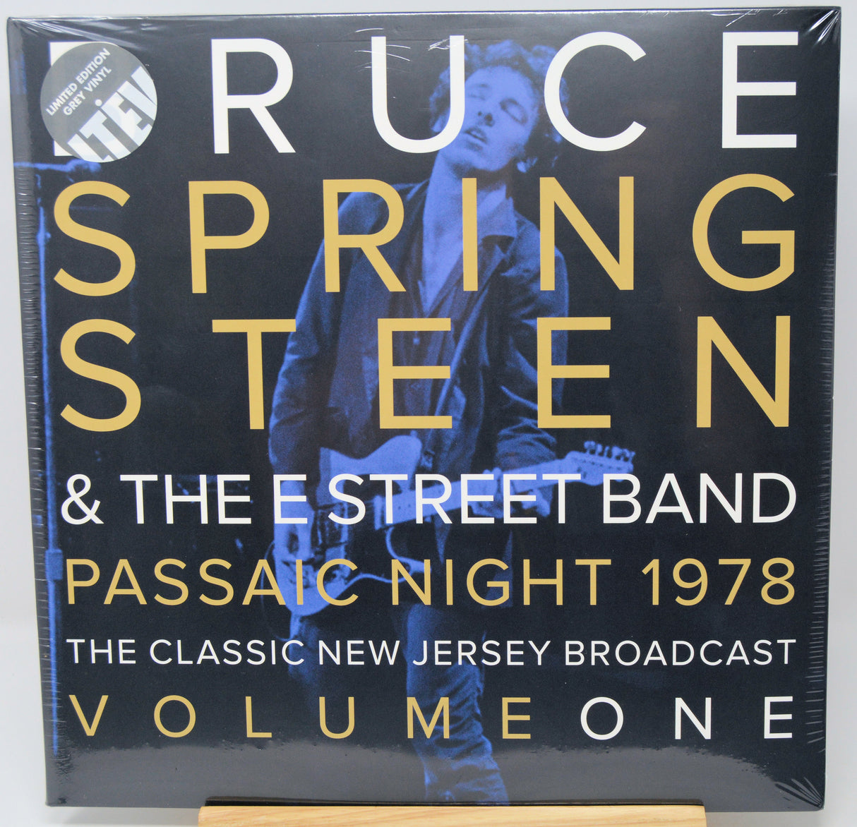 A square vinyl record sleeve for 'Ruce Springsteen & The Street Band: Passaic Night 1978' on a white background. The sleeve features a dark blue-toned photo of Bruce Springsteen, large gold and white text, and a circular 'Limited Edition' sticker in the top left corner.