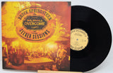 Bruce Springsteen's 'We Shall Overcome' 'Jester Sessions' vinyl record album, showing the illustrated front cover and the black vinyl record partially pulled out, on a white background.