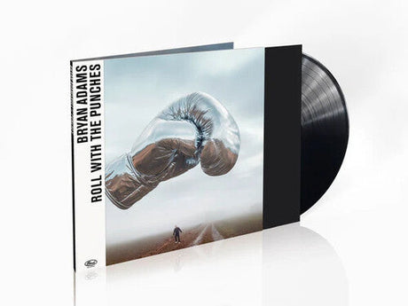 Bryan Adams Roll With The Punches vinyl record album cover with a metallic boxing glove.