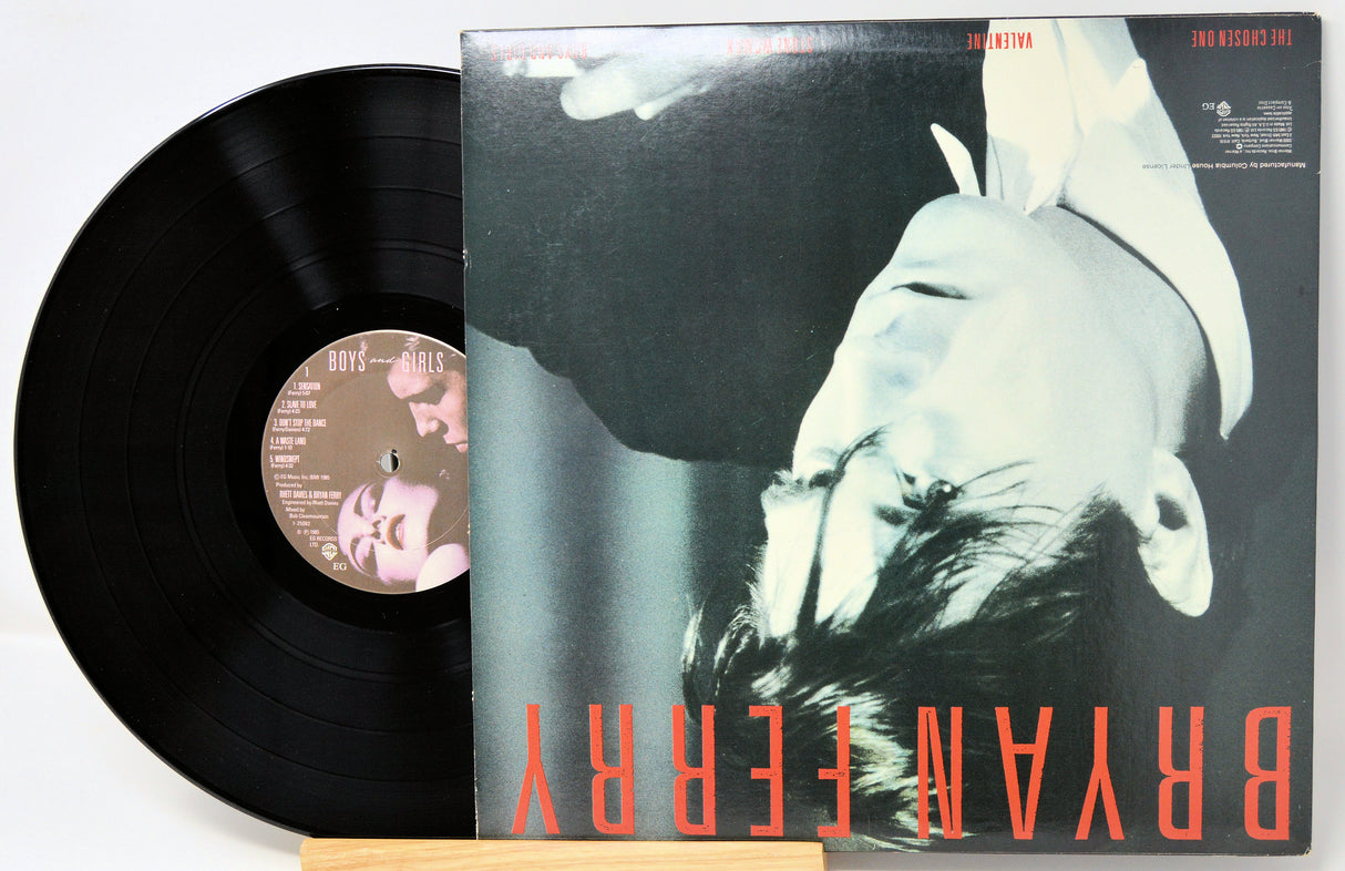 Vinyl record with cover featuring a black and white image of a person and red text.