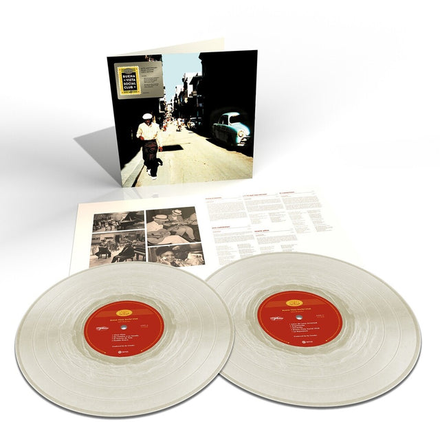 Vinyl records with a cover featuring a street scene and additional documents on a white background
