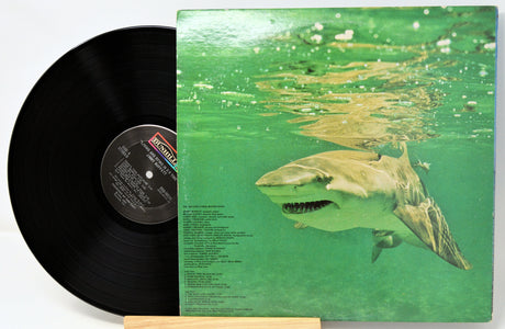 Vinyl record with a shark underwater on the cover