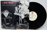 Vinyl record with cover featuring T-Bone Burnett and album title 'Proof Through the Night'.