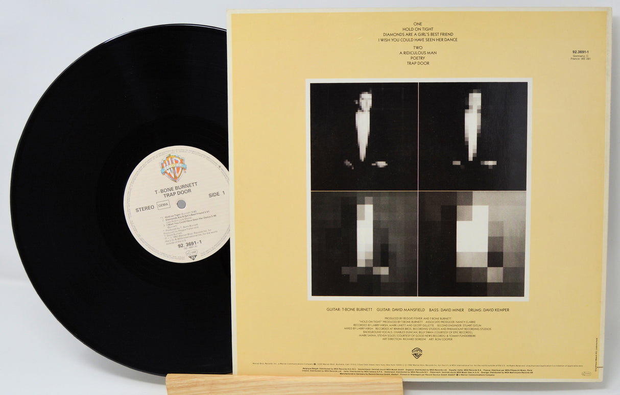 Vinyl record with a yellowed cover featuring black and white images of a person and text.