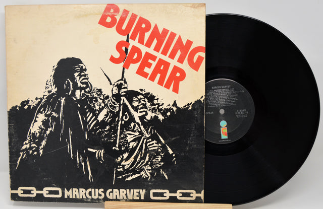 Vinyl record with 'Burning Spear' album cover featuring a figure holding a spear.