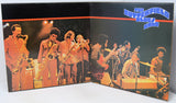 An open vinyl record sleeve for 'The Butler Blues Band' showing a live jazz performance with saxophonists, guitarists, and a keyboardist on a black background with orange and blue graphic accents.