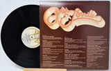 Vinyl record with cover featuring 'Captain & Tennille' on a light gray background