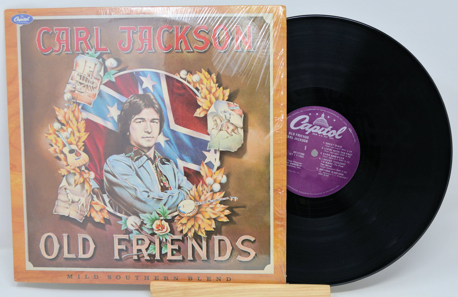 Front cover of Carl Jackson's Old Friends vinyl album featuring portrait artwork and Confederate flag backdrop