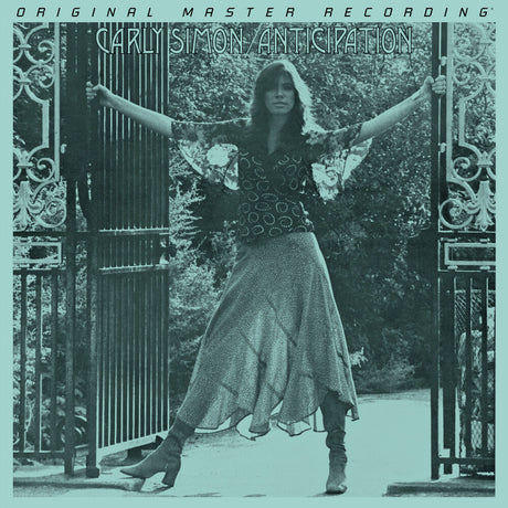 Album cover with a person standing between two gates, text at the top