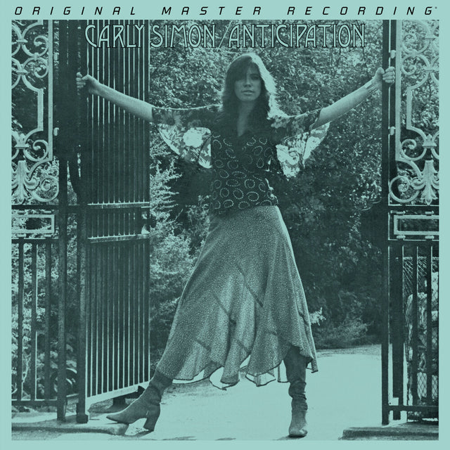 Album cover with a person standing between two gates, text at the top