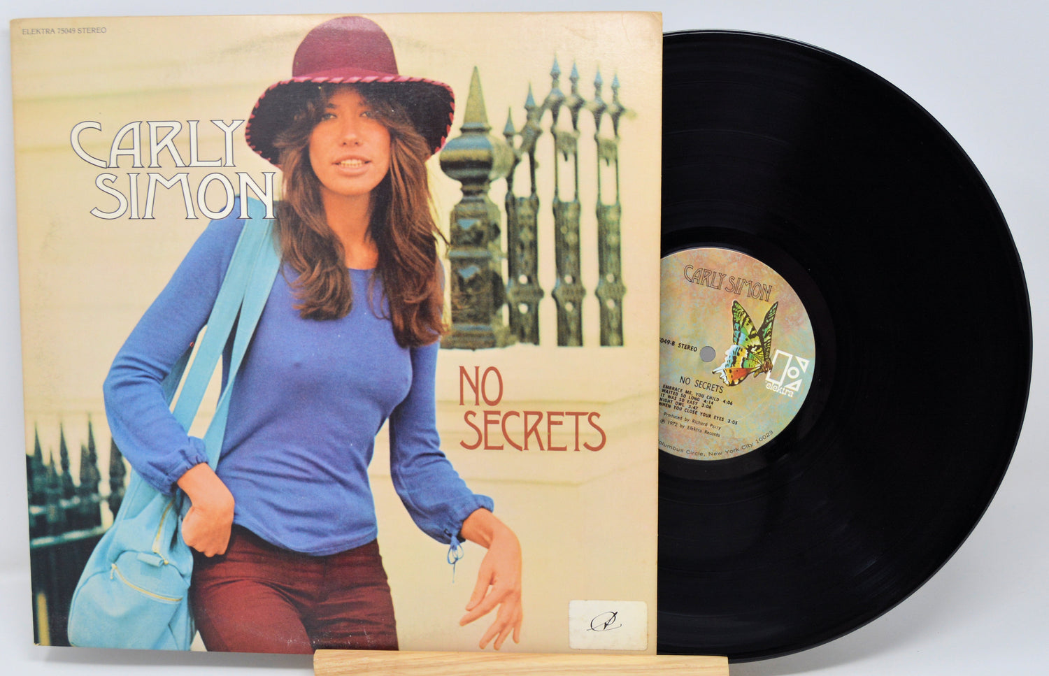 Vinyl record with cover featuring a woman and 'No Secrets' text