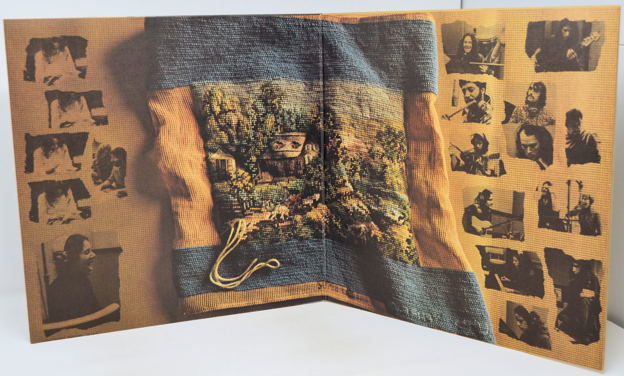 Open book with a landscape illustration on a textured surface