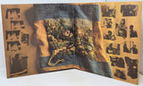 Open book with a landscape illustration on a textured surface