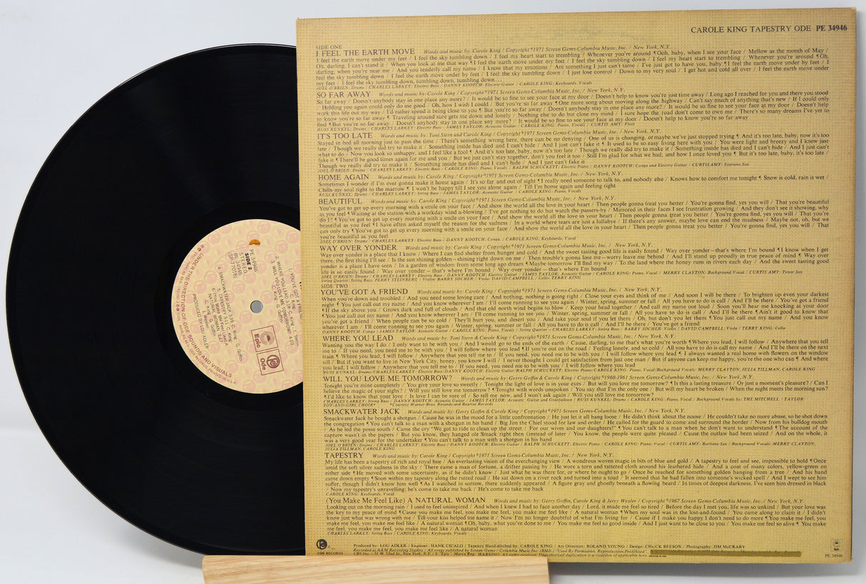 Vinyl record with a detailed back cover on a white background
