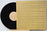 Vinyl record with a detailed back cover on a white background