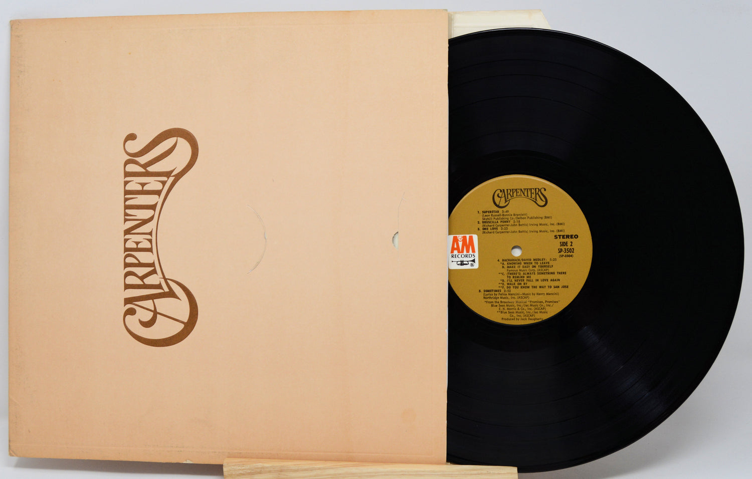Vinyl record with a yellow label and cover featuring 'The Carpenters' logo.
