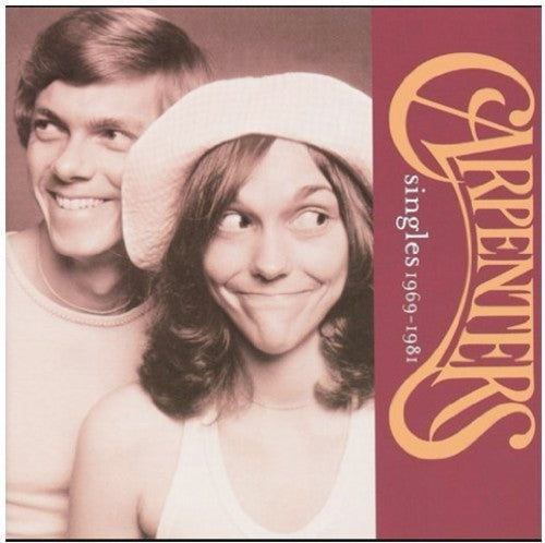 Album cover featuring a man and woman with the Carpenters logo on a red background Greatest its CD