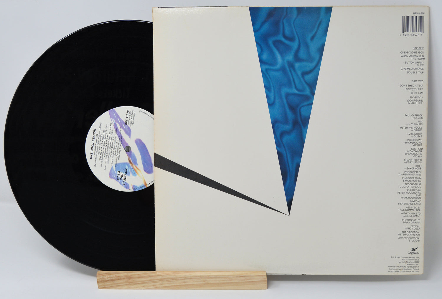 Vinyl record by Paul Carrack titled one good reason showing the album and back cover with text listing the song titles and credits.