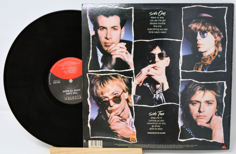 Vinyl record with a cover featuring multiple images of a person on a white background
