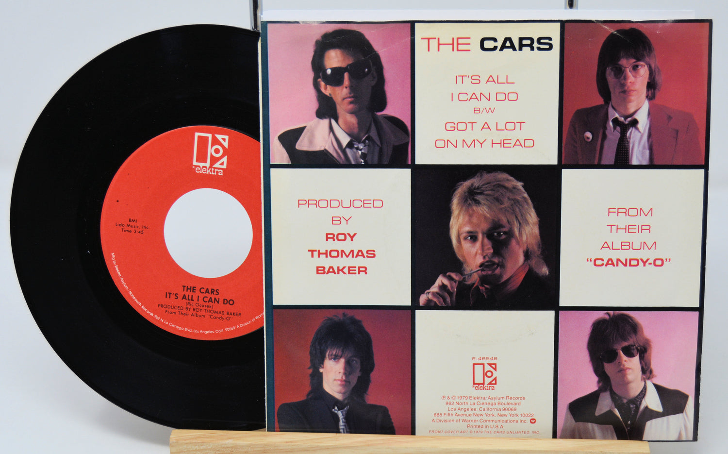 Vinyl record with sleeve featuring 'The Cars' music album cover