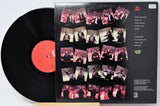 Vinyl record with a colorful cover featuring multiple images of a person.