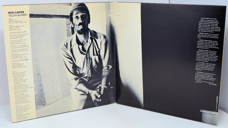 Album cover with a black and white photo of a person on the left and text on the right.