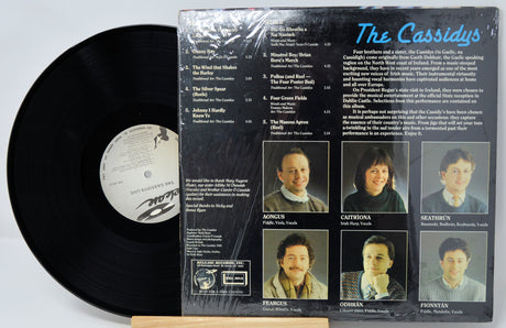 Vinyl record with cover featuring images of a family and text.
