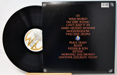 Vinyl record with cover displaying album tracklist on a white background