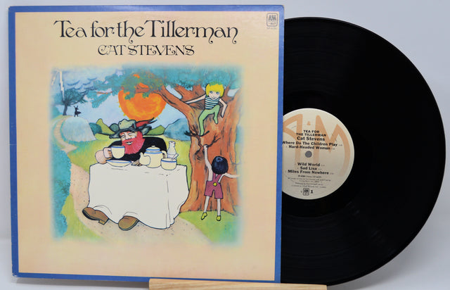Vinyl record and cover of 'Tea for the Tillerman' by Cat Stevens on a light gray background