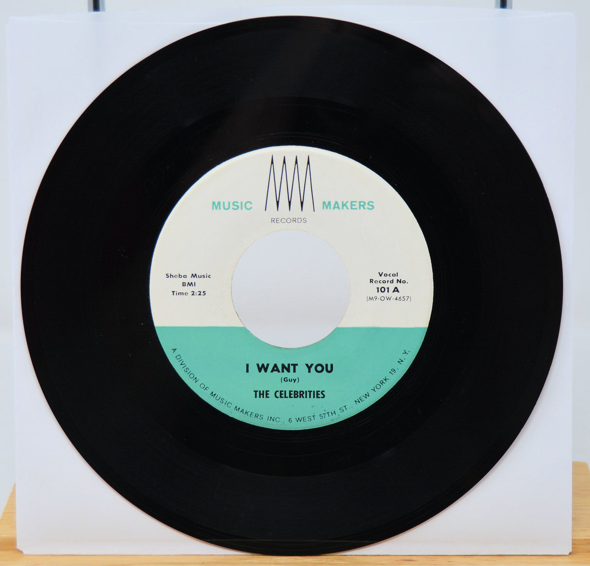 Vinyl record with a white label featuring text and a black border.