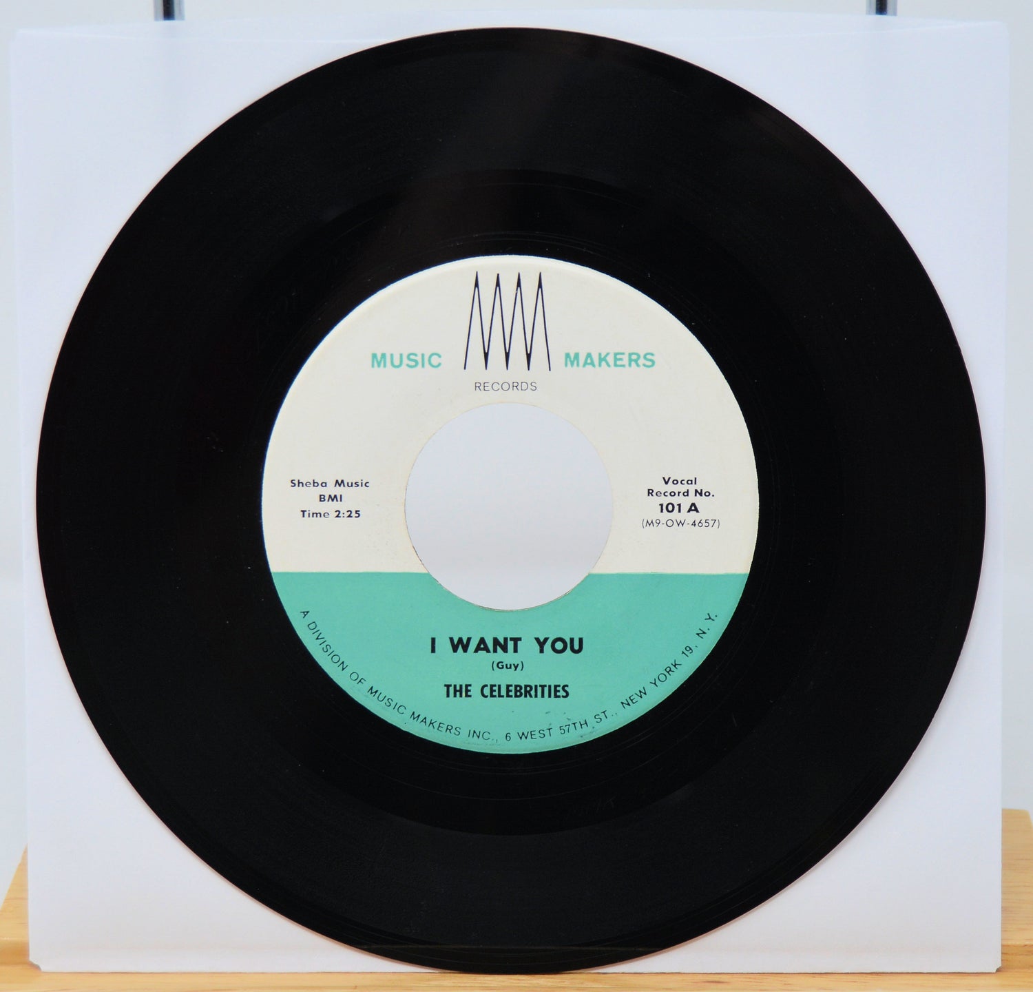 Vinyl record with a white label featuring text and a black border.