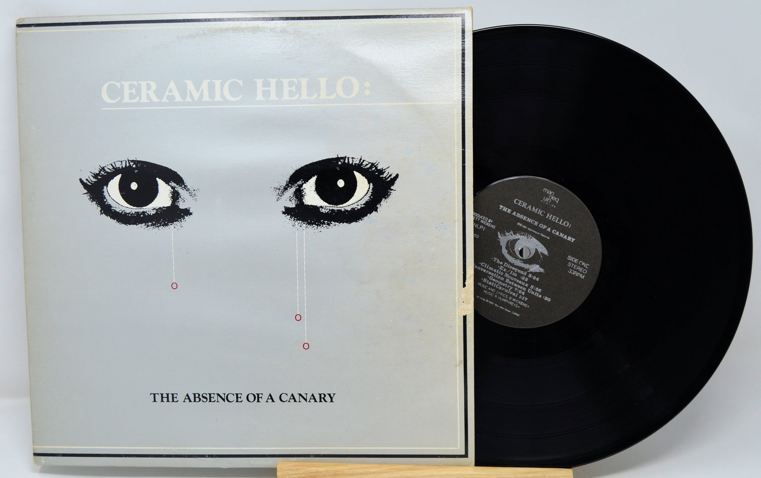 Vinyl record and cover with 'Ceramic Hello' album art on a white background