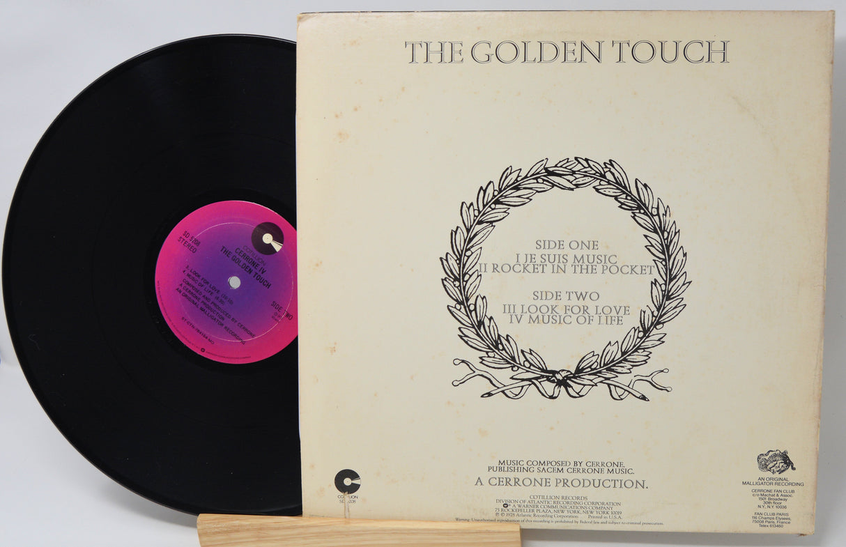 Vinyl record with cover titled 'The Golden Touch' on a white background