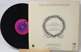 Vinyl record with cover titled 'The Golden Touch' on a white background