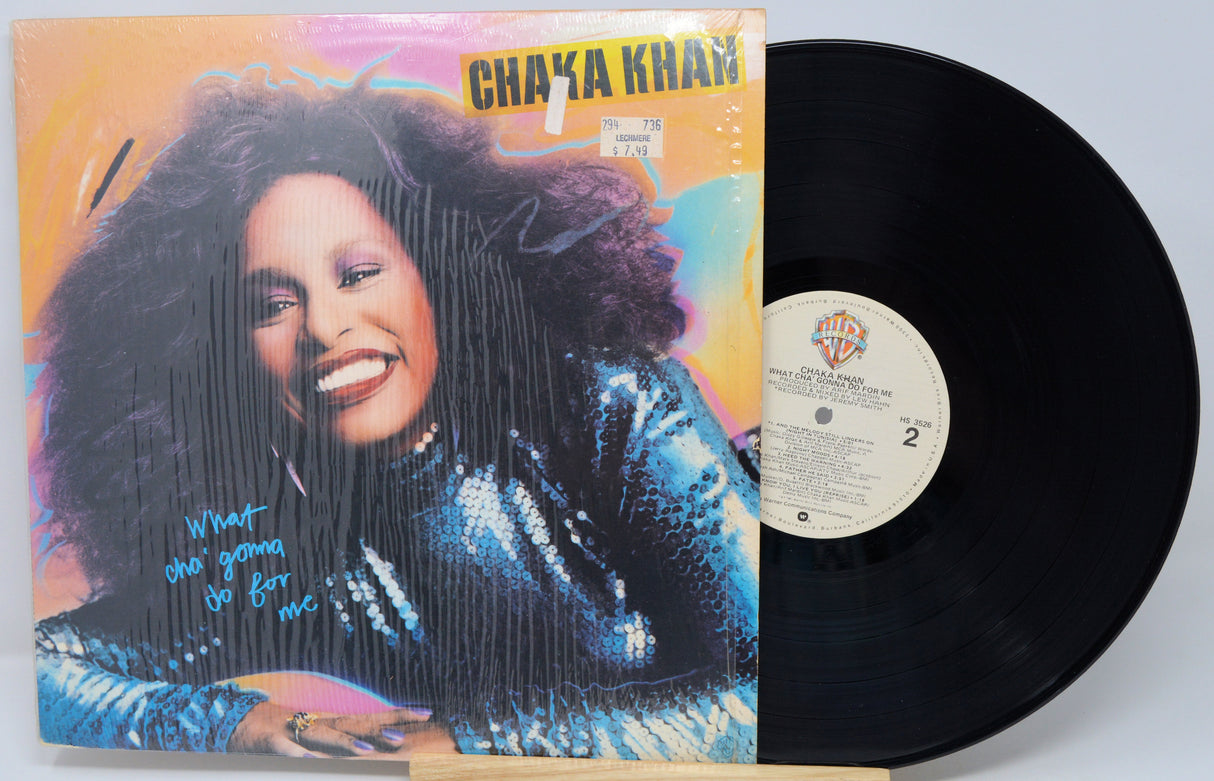 Vinyl record with a colorful cover featuring a woman and the title 'Chaya Khan'.