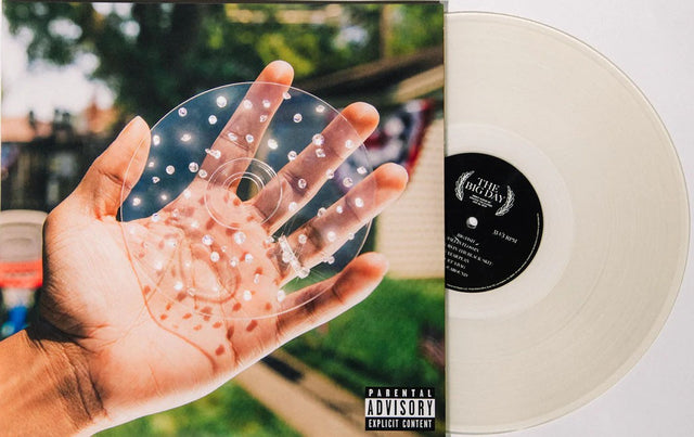 'Chance The Rapper' vinyl record titled 'The Big Day' with a hand holding a clear plastic disc against a blurred outdoor background.