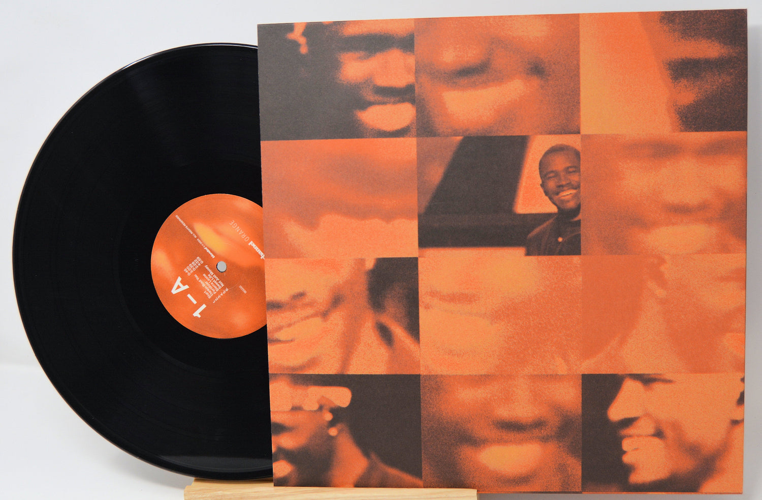 Channel Orange vinyl record with album cover showing abstract orange mosaic of faces