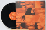 Channel Orange vinyl record with album cover showing abstract orange mosaic of faces