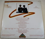 Back cover of Chanson vinyl album featuring tracklist and band photo