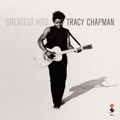 Album cover of Tracy Chapman's 'Greatest Hits' with a black and white photo of the artist holding a guitar.