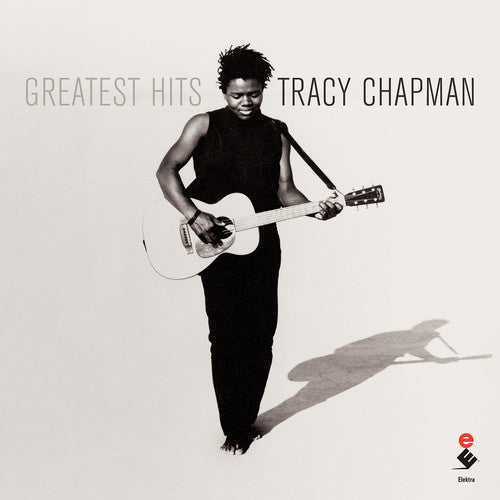 Album cover of Tracy Chapman's 'Greatest Hits' with a black and white photo of the artist holding a guitar.