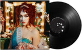 Vinyl record with a cover featuring Chappell Roan with red hair and decorative elements.