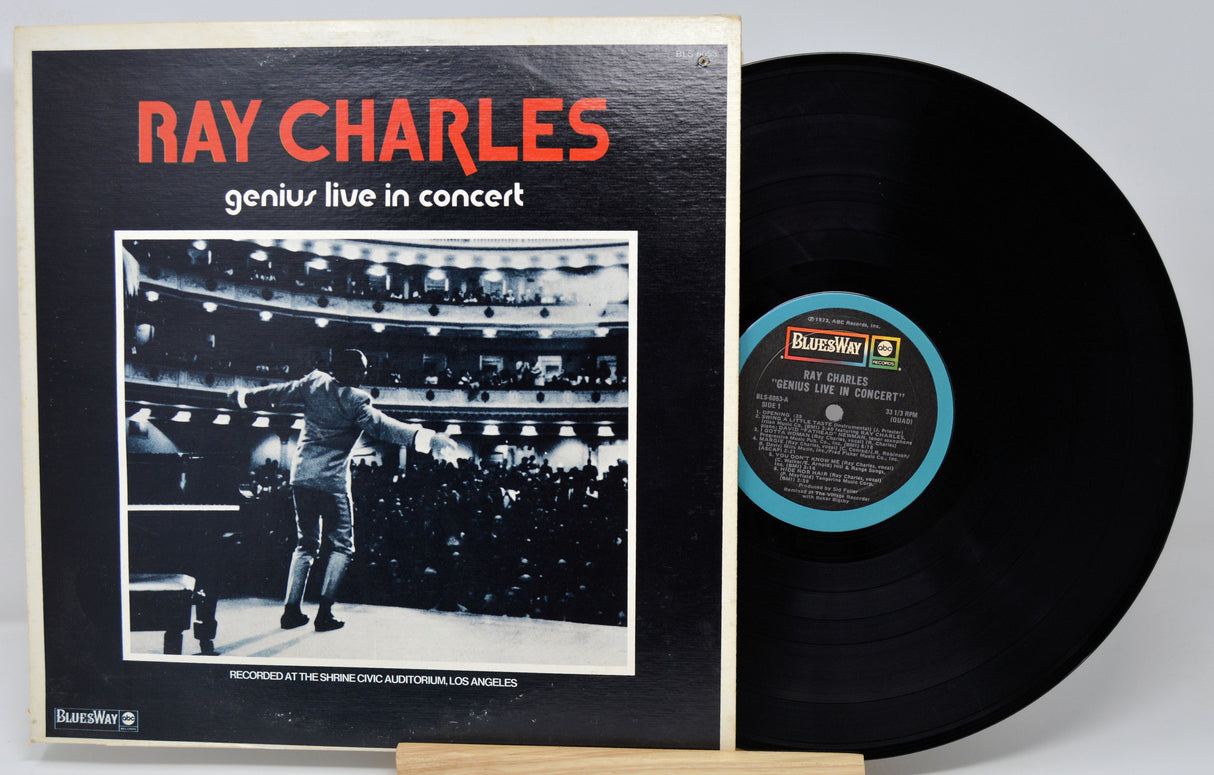 Vinyl record with cover featuring Ray Charles performing on stage.