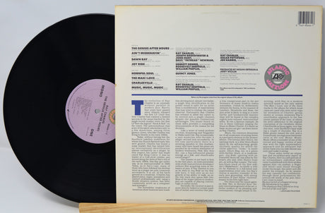 Vinyl record with text and a purple label on a white background