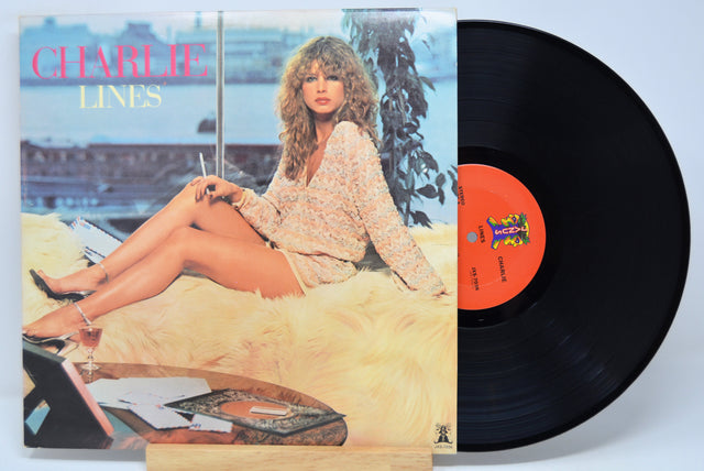 'Charlie Lines' Vinyl record with cover featuring a woman sitting on a couch by a window.