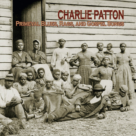 Album cover with black and white photo of people in front of a wooden building, featuring text 'Charlie Patton Primeval Blues, Rags, and Gospel Songs'.